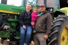 Amber-Evelynn-and-Logan-Dwyer-on-tractor