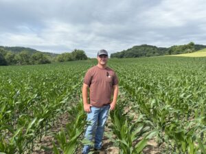 Man poses in corn field